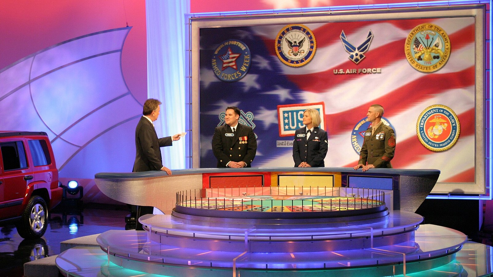 The Wheel of Fortune wheel and contestant stage, photographed during a 2006 Armed Forces Week taping at the show's Culver City studio, is the set where the off-camera announcer role Sony Pictures